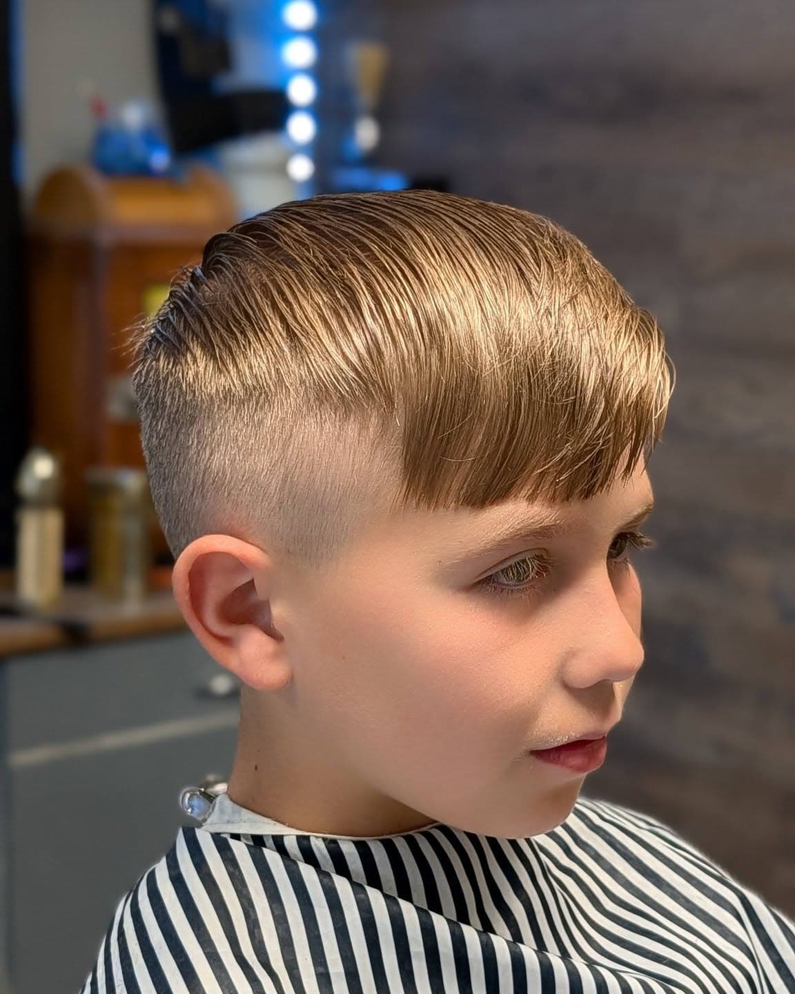 Young client with a sharp fade haircut at Gary's Barber Shop
